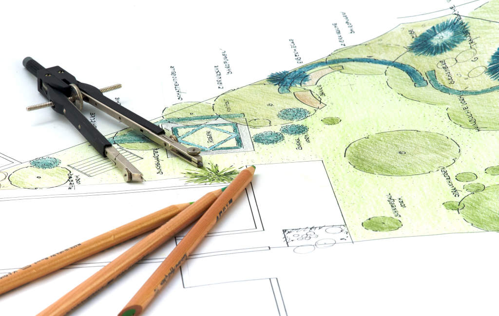 Gartenplan mit Planungsutensilien: Zirkel und Bleistift